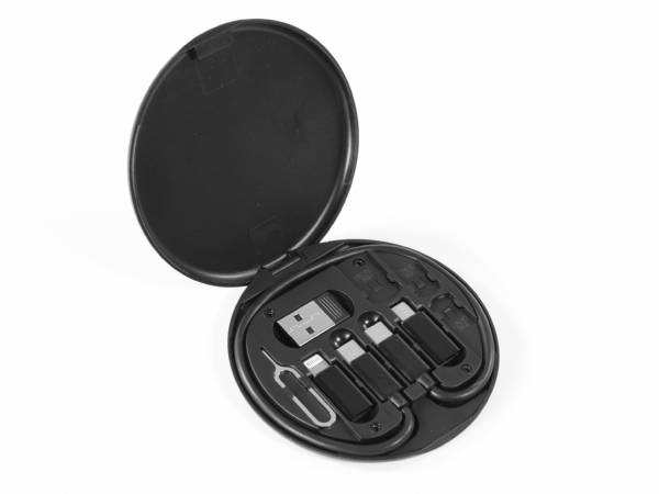 Adapter-Set mit verschiedenen USB-Anschlüssen in einer praktischen, runden Aufbewahrungsbox für mobile Geräte.